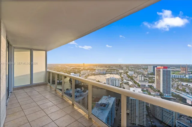 a view of a swimming pool and trees in the background