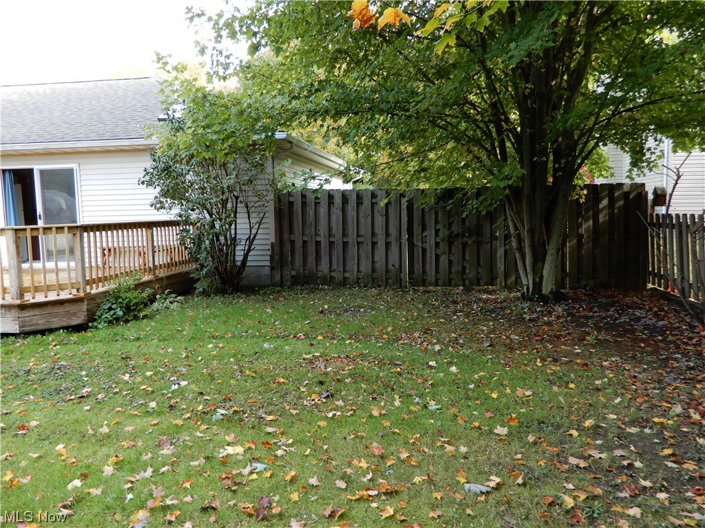 1168 Dock Road Madison, OH 44057 - Photo 6 of 35 View of yard with a wooden deck