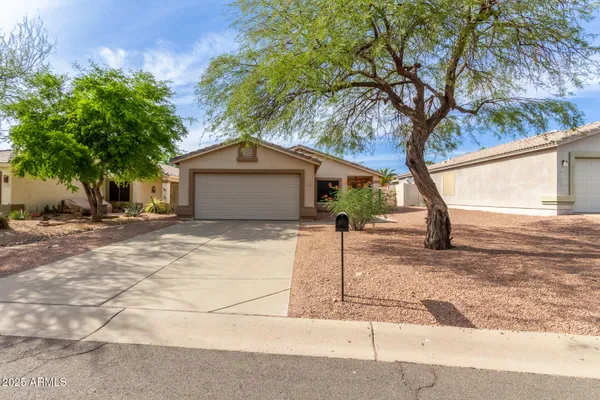 a house with trees in the background