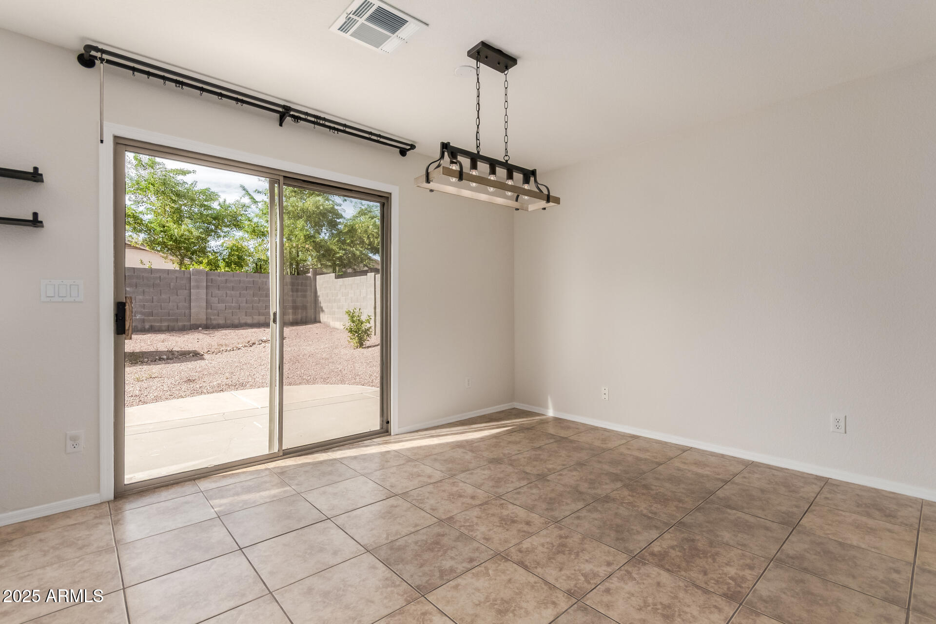 6932 South Russet Sky Way Gold Canyon, AZ 85118 - Photo 11 of 36 a view of an empty room with a window