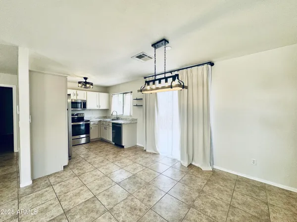 a view of a kitchen with a sink