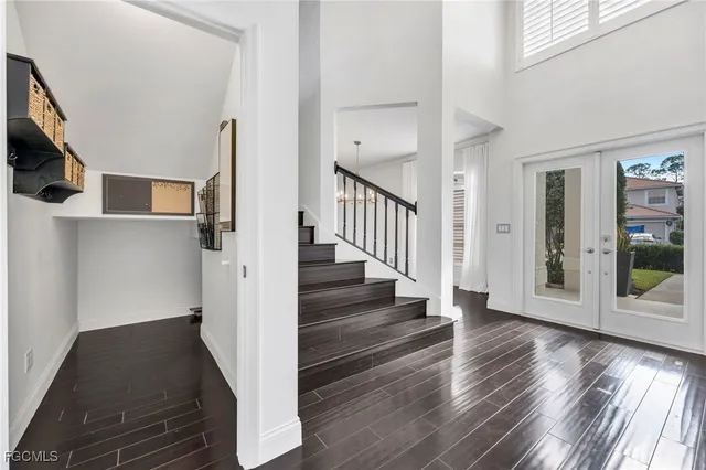 a bed room with a bed window and a television
