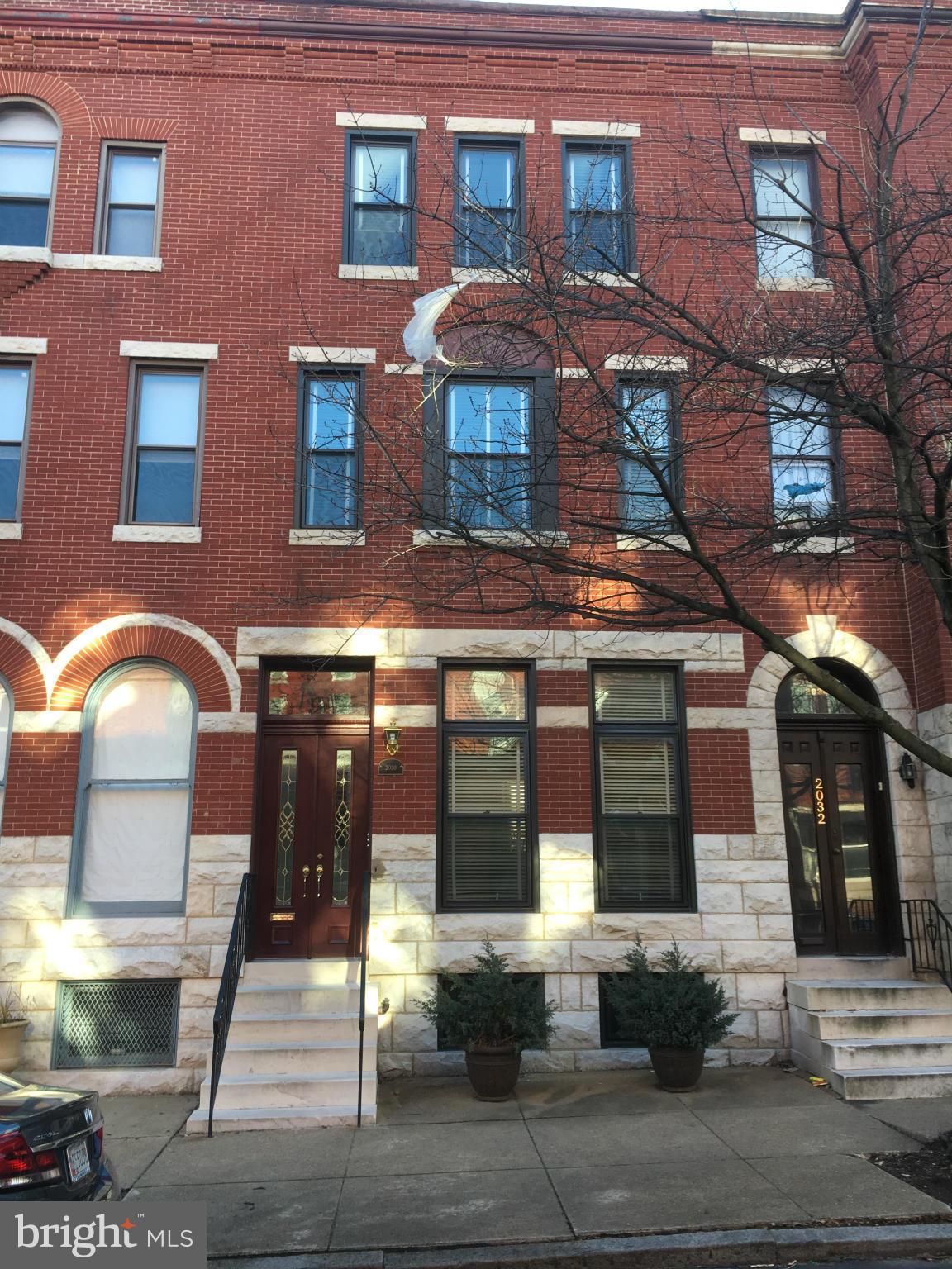 2030 Madison Avenue Baltimore, MD 21217 - Photo 2 of 24 a front view of a building