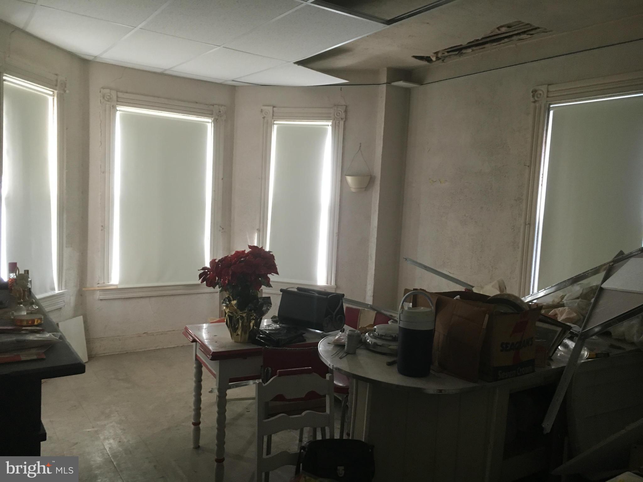 2030 Madison Avenue Baltimore, MD 21217 - Photo 17 of 24 a table and chairs in a room