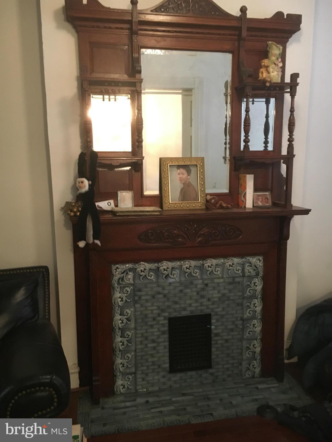 2030 Madison Avenue Baltimore, MD 21217 - Photo 4 of 24 a fireplace with wooden floor