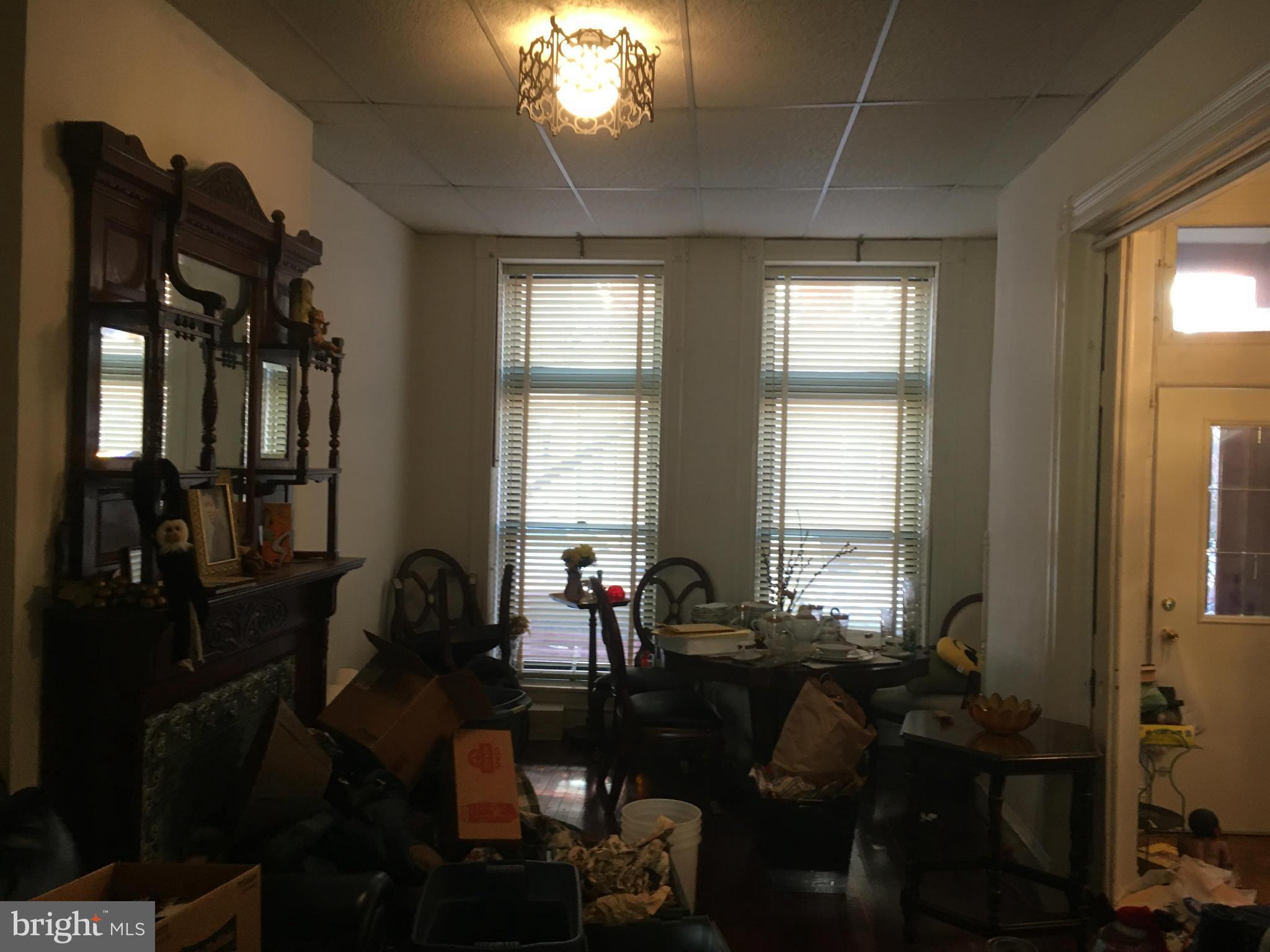 2030 Madison Avenue Baltimore, MD 21217 - Photo 5 of 24 a living room with furniture and a chandelier