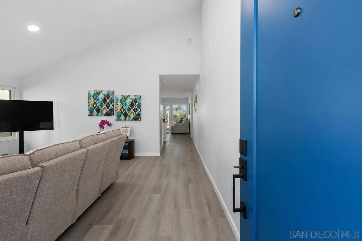 1374 Valencia Loop Chula Vista, CA 91910 - Photo 20 of 35 a living room with furniture and a wooden floor