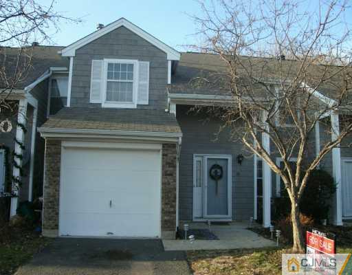 59 Renaissance Lane New Brunswick, NJ 08901 - Photo 1 of 7 a front view of a house with garden