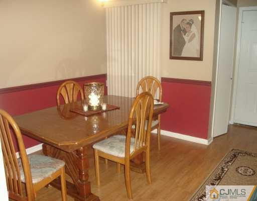 59 Renaissance Lane New Brunswick, NJ 08901 - Photo 3 of 7 a view of a dining room with furniture and wooden floor