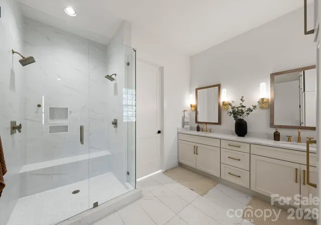 a bathroom with a tub sink and mirror