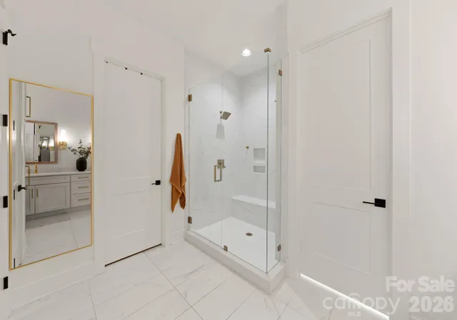 a bathroom with a bathtub and a shower