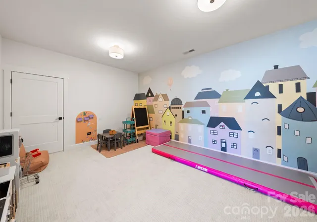 a room with toys and a chandelier