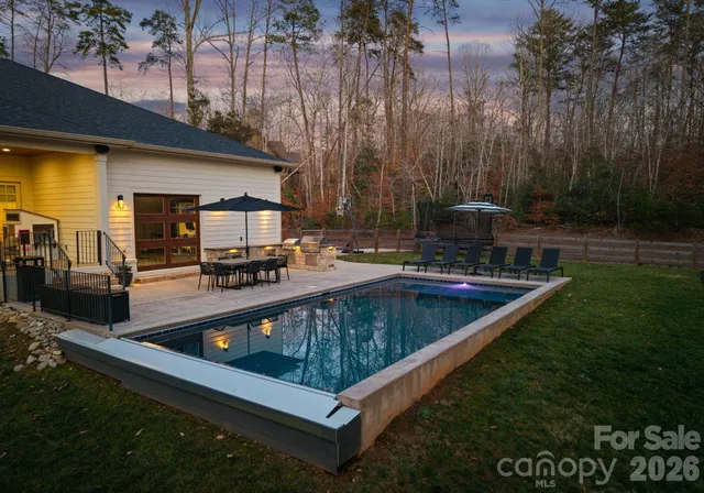a view of a swimming pool with a patio