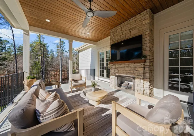 a living room with furniture fireplace and a flat screen tv