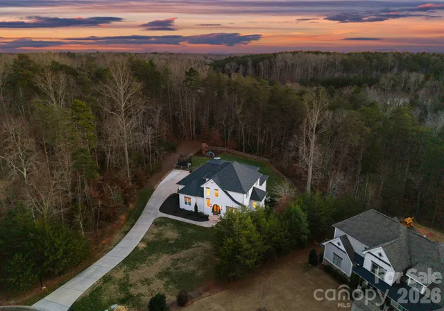 a view of a house with a mountain in the background