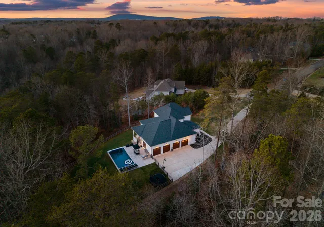 a view of swimming pool with chairs
