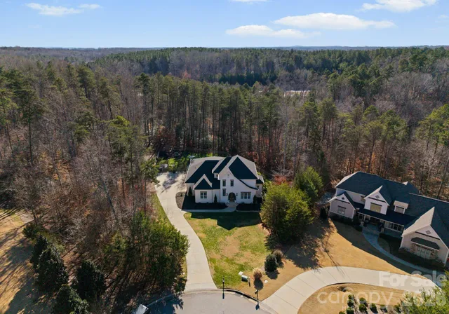 an aerial view of a house with a garden