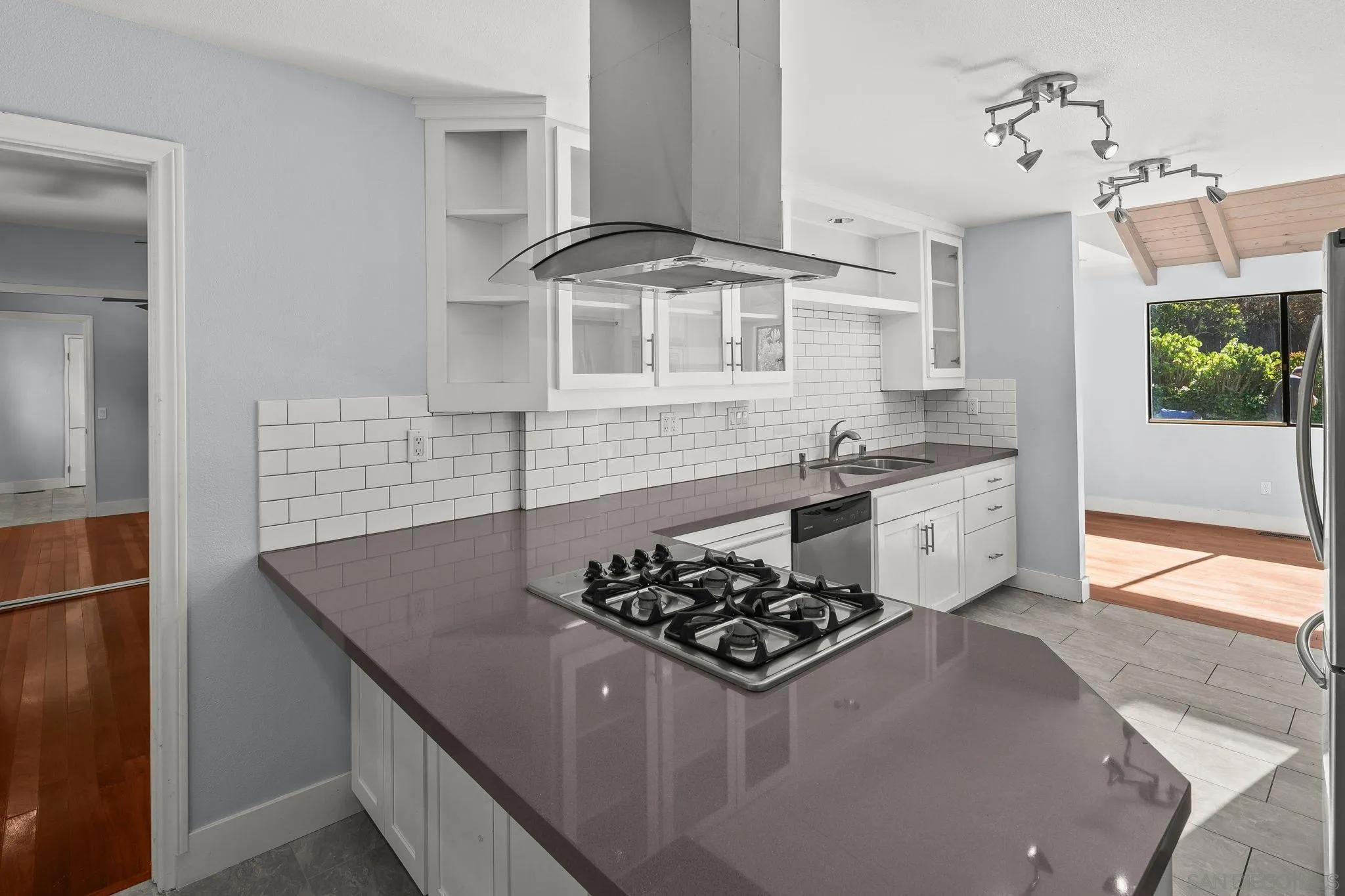 9190 Spice Street La Mesa, CA 91941 - Photo 12 of 44 a kitchen with stainless steel appliances granite countertop a sink stove and refrigerator