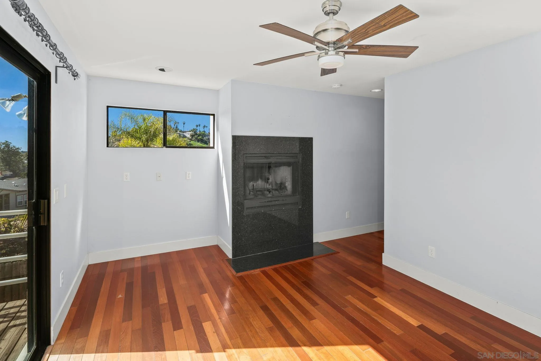 9190 Spice Street La Mesa, CA 91941 - Photo 16 of 44 a view of a hallway with wooden floor