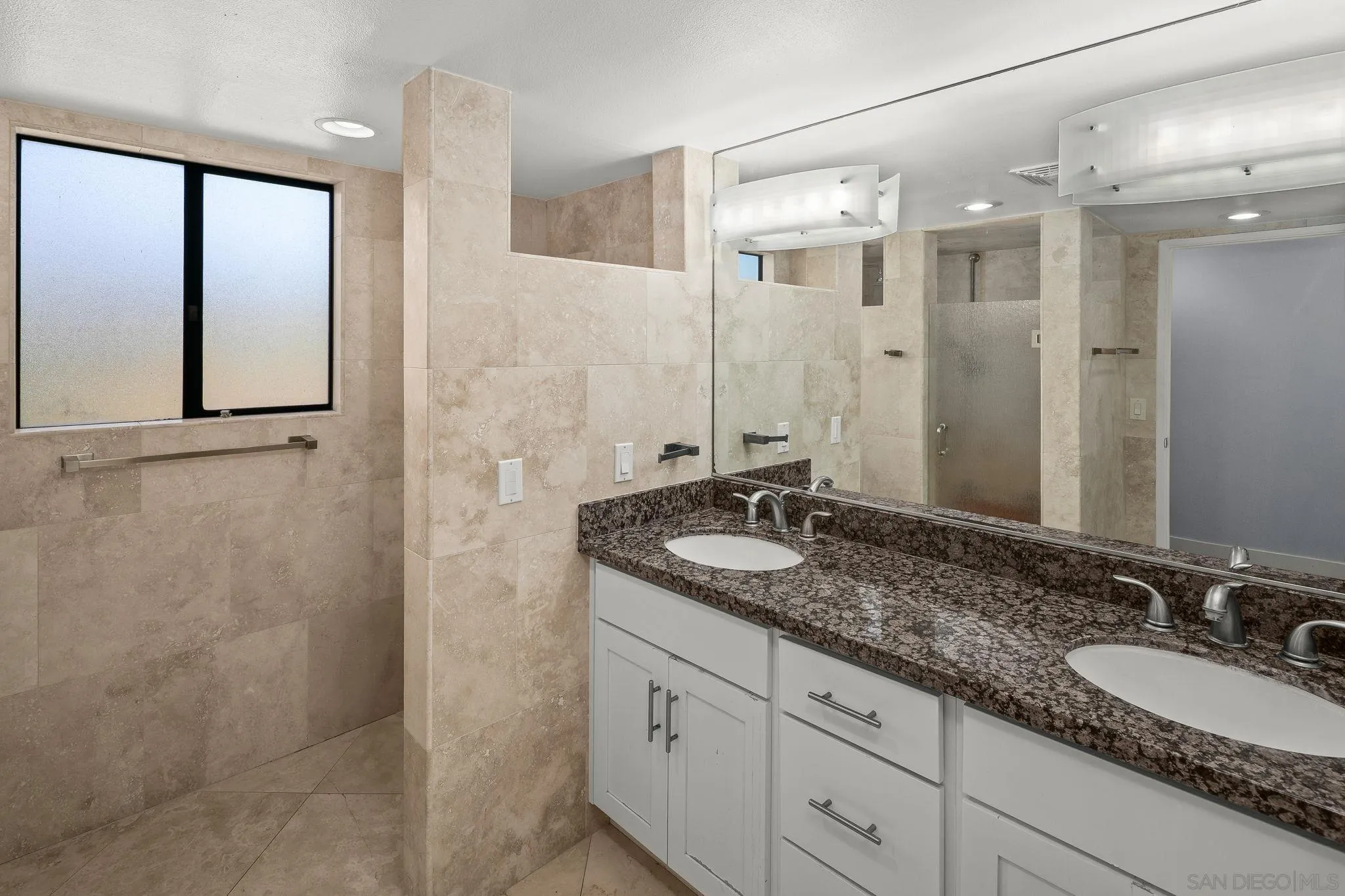 9190 Spice Street La Mesa, CA 91941 - Photo 17 of 44 a bathroom with a granite countertop double vanity sink and mirror
