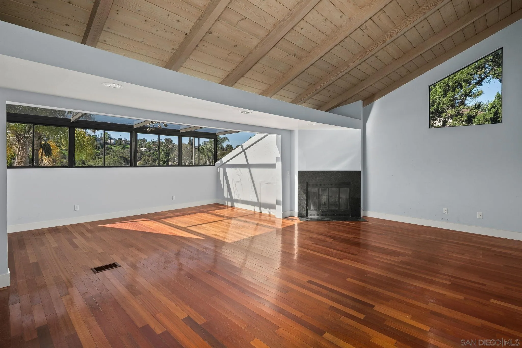 9190 Spice Street La Mesa, CA 91941 - Photo 2 of 44 an empty room with wooden floor and windows