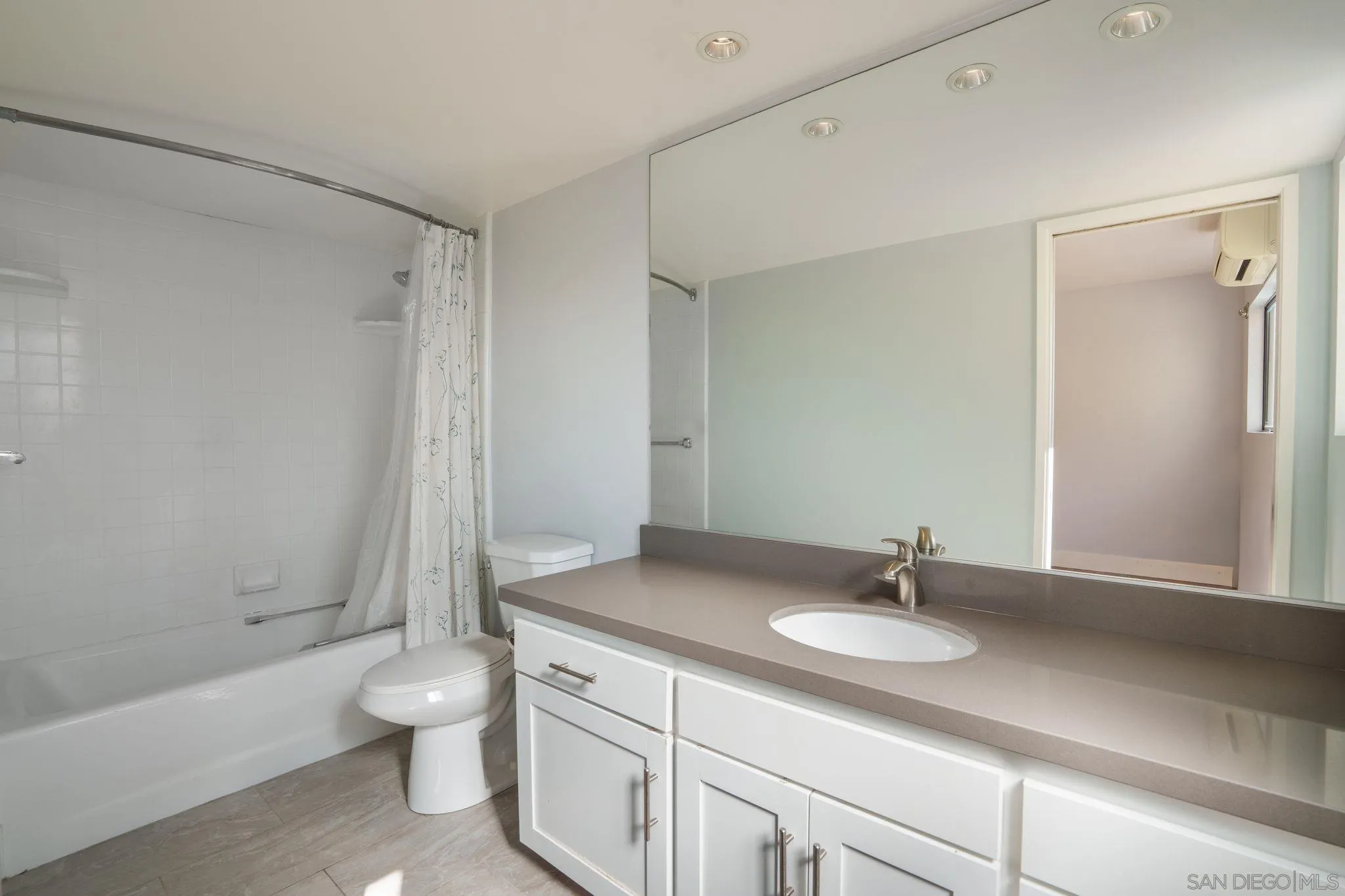 9190 Spice Street La Mesa, CA 91941 - Photo 23 of 44 a bathroom with a sink a toilet and a bathtub
