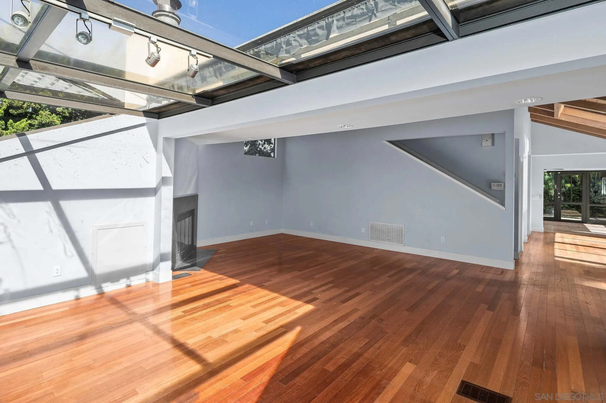9190 Spice Street La Mesa, CA 91941 - Photo 5 of 44 a view of a hallway with wooden floor