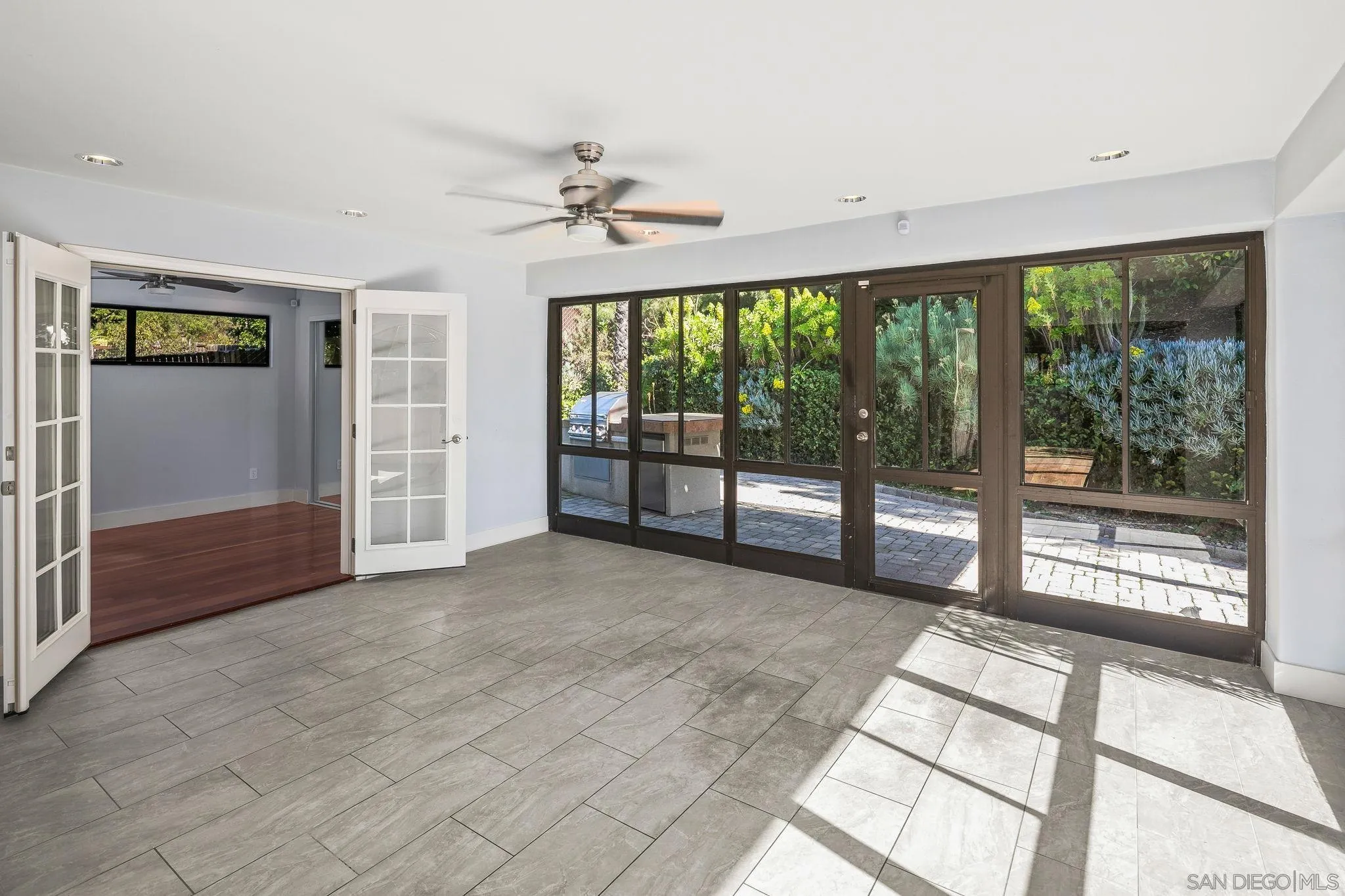 9190 Spice Street La Mesa, CA 91941 - Photo 6 of 44 a view of an empty room with wooden floor and a window