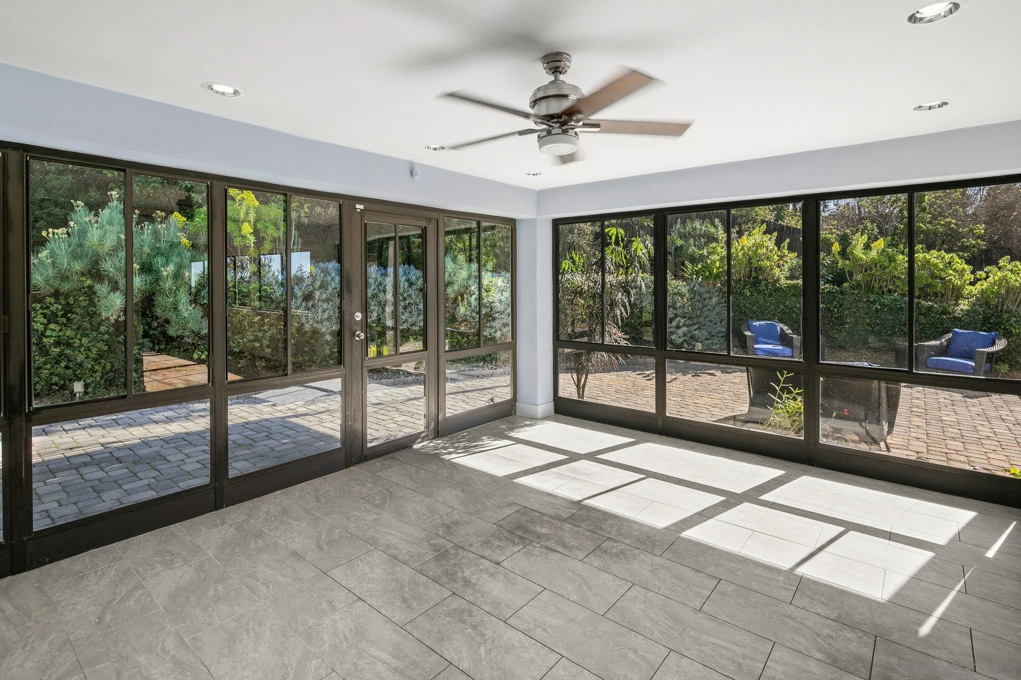 9190 Spice Street La Mesa, CA 91941 - Photo 7 of 44 a view of an empty room with wooden floor and a floor to ceiling window