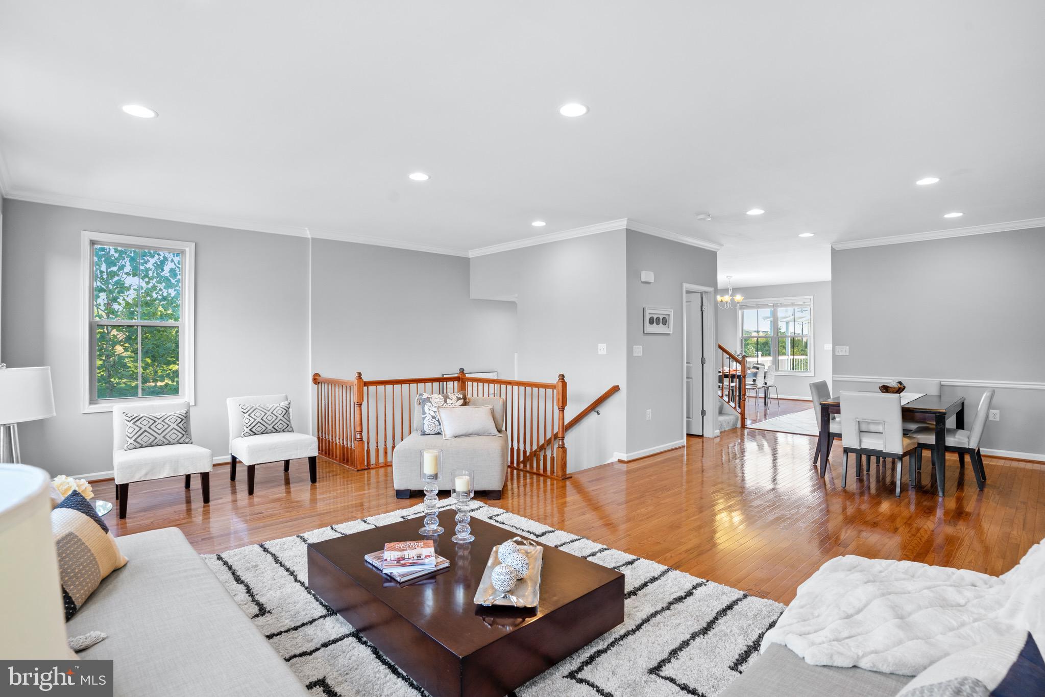42203 Castle Ridge Square Brambleton, VA 20148 - Photo 4 of 29 Gleaming hardwood floors in the living room