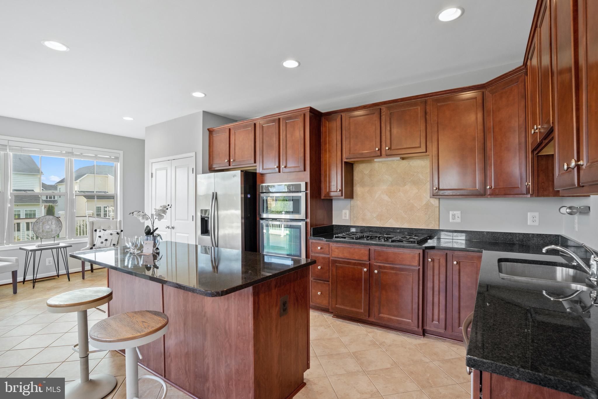 42203 Castle Ridge Square Brambleton, VA 20148 - Photo 8 of 29 Gourmet kitchen with plenty of cabinet space