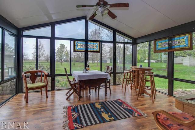 7647 White Oaks Road Clinton, IL 61727 - Photo 11 of 30 a view of a dining room with furniture window and wooden floor