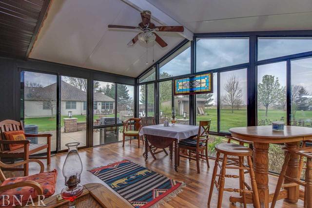 7647 White Oaks Road Clinton, IL 61727 - Photo 13 of 30 a dining room with furniture large windows and wooden floor