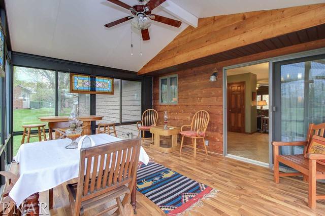 7647 White Oaks Road Clinton, IL 61727 - Photo 14 of 30 a dining room with furniture a chandelier and wooden floor