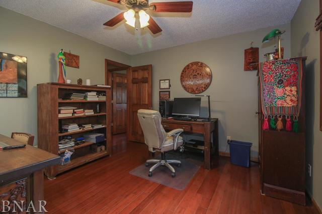 7647 White Oaks Road Clinton, IL 61727 - Photo 17 of 30 a view of a workspace with furniture and wooden floor