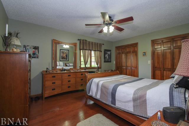 7647 White Oaks Road Clinton, IL 61727 - Photo 20 of 30 a bedroom with a bed and a dresser