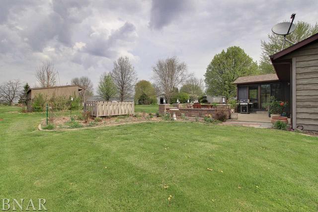 7647 White Oaks Road Clinton, IL 61727 - Photo 25 of 30 a front view of a house with garden