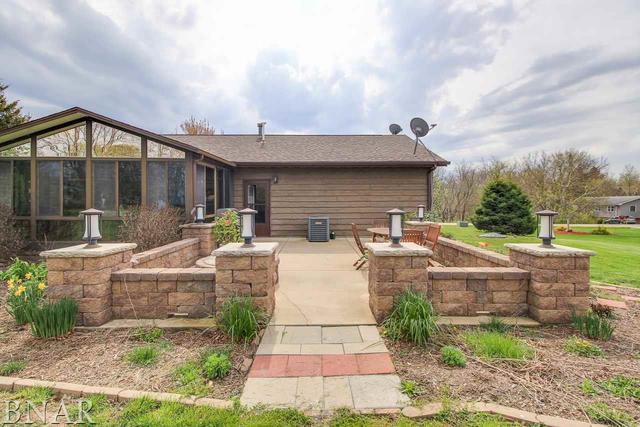 7647 White Oaks Road Clinton, IL 61727 - Photo 28 of 30 a view of house with backyard and outdoor seating
