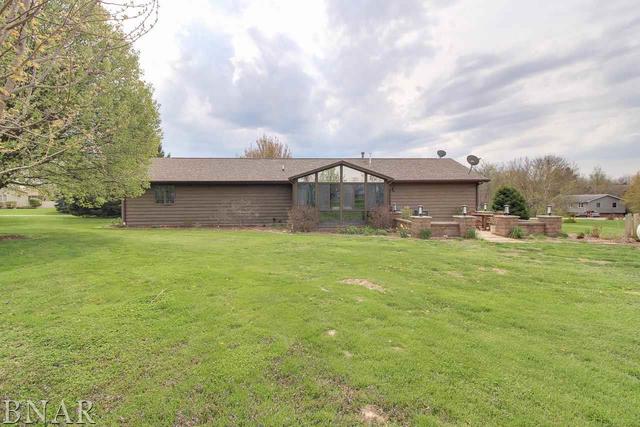 7647 White Oaks Road Clinton, IL 61727 - Photo 29 of 30 a view of a house with a big yard and a large tree
