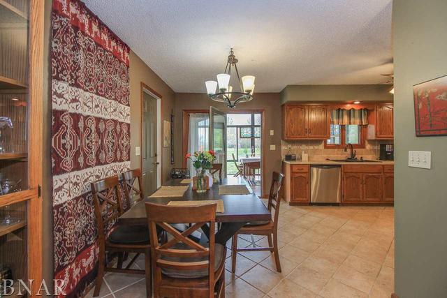 7647 White Oaks Road Clinton, IL 61727 - Photo 6 of 30 a view of a dining room with furniture and chandelier