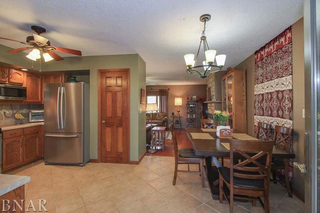 7647 White Oaks Road Clinton, IL 61727 - Photo 7 of 30 a view of a dining room with furniture window and wooden floor