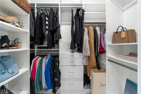 a view of storage and utility room with washer and dryer