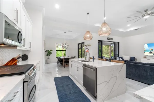 an aerial view of a house with a yard basket ball court and outdoor seating