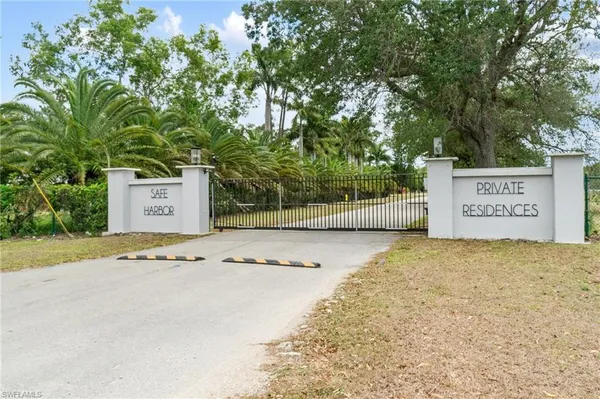 an aerial view of house with yard and swimming pool