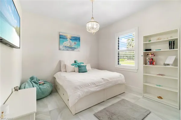 a bathroom with a sink vanity mirror and toilet