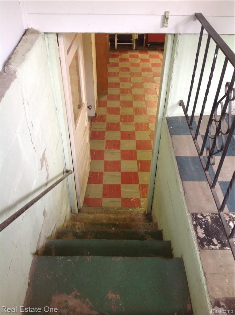 6337 Maybee Road Clarkston, MI 48346 - Photo 55 of 59 Basement Steps & Tiled Basement Room