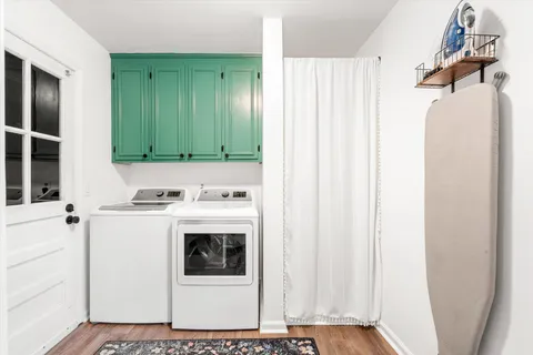 a bedroom with a bed and a mirror