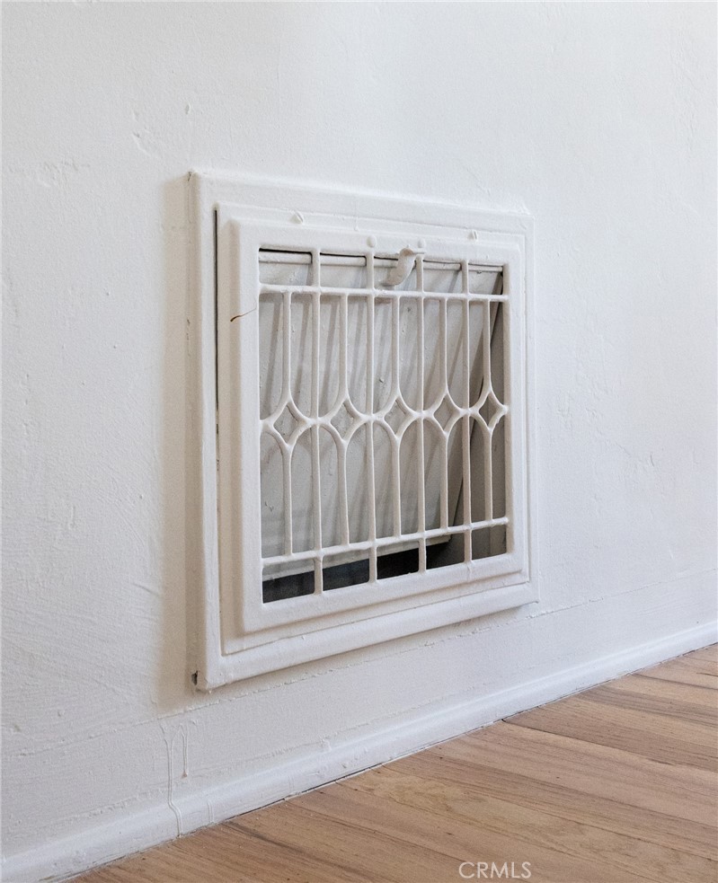 2324 North Riverside Drive Santa Ana, CA 92706 - Photo 45 of 52 a view of an empty room with wooden floor and a window
