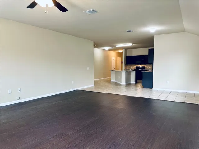 a view of room and hardwood floor