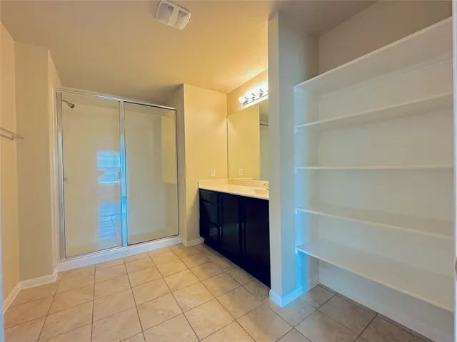 a view of an empty walk in closet